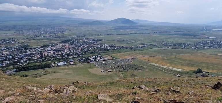 Armenia landscape, village, mountains, lake Sevan, summer scenery oncoming storm