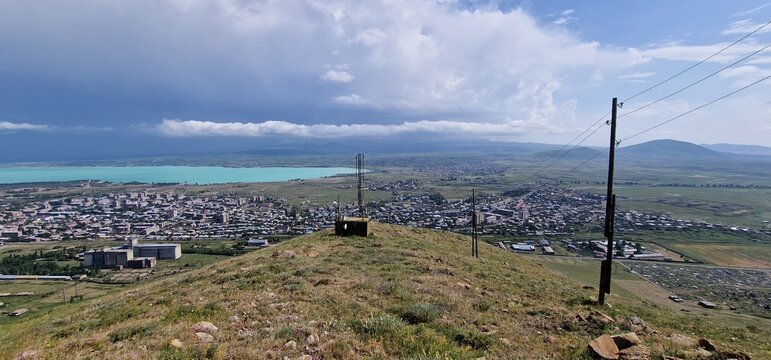 Armenia landscape, village, mountains, lake Sevan, summer scenery oncoming storm