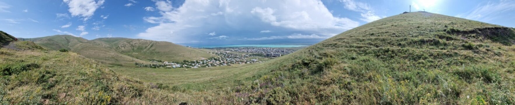 Armenia landscape, village, mountains, lake Sevan, summer scenery oncoming storm