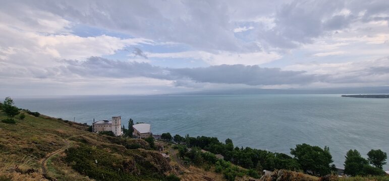 lake sevan in armenia and clouds falling over the mountains