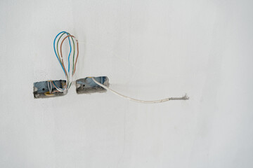 Holes in the wall for sockets with wires