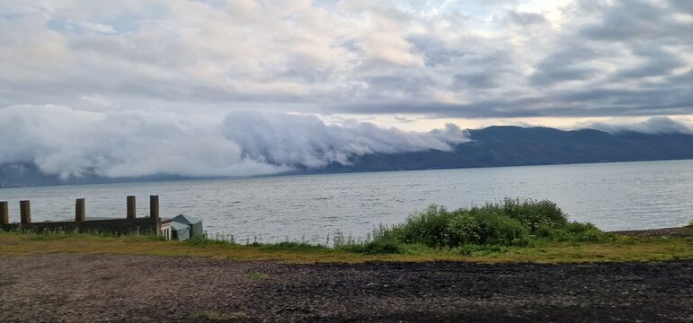 lake sevan in armenia and clouds falling over the mountains