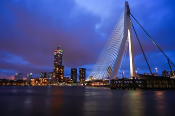 Wall murals Erasmus Bridge Rotterdam, Netherlands - December 26, 2023: Rotterdam Skyline with Erasmus bridge at twilight.