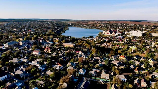 Aerial view. Beautiful cottages near the blue lake. Ukrainian town. Korsun-Shevchenkivskyi. Cherkasy Oblast. Ukraine.
