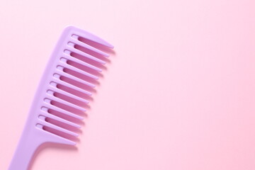 pink comb on pink background