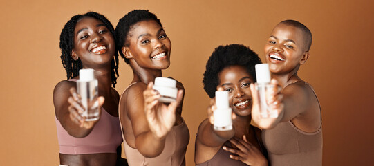 Happy black woman, skincare and beauty products for tone or foundation against a brown studio...