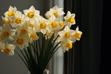  a vase filled with yellow and white flowers sitting on a window sill in front of a window sill with a gray wall and a window in the background.