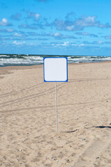 white empty signboard on the Baltic beach