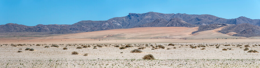 mountain range and colorful sand slopes in Naukluft desert, near Garub,  Namibia