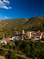 Fototapeta premium Aerial view of Almudaina village with its church and the famous medieval tower , Alicante, Costa Blanca, Spain - stock photo