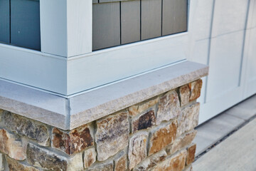 Textured Stone and Board Batten Siding Detail - Modern Home Exterior