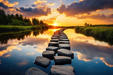  the sun is setting over a body of water with rocks in the foreground and a line of stepping stones in the middle of the water in the foreground. - Powered by Adobe