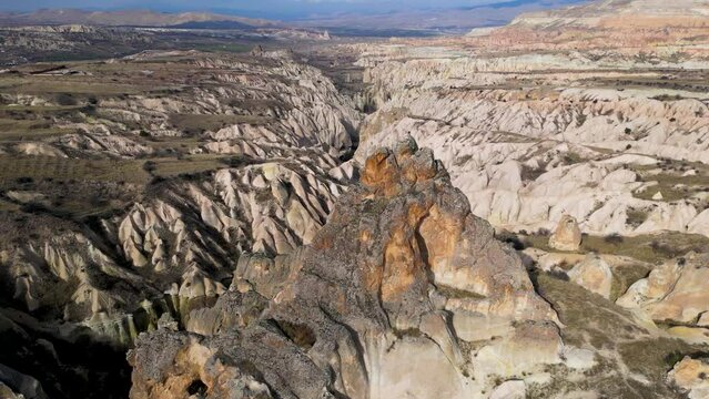 Aerial drone view of the natural beauty of the Rose Red Valley in Cappadocia, Turkey. Famous destination for hikers to explore the Rock Sites of Cappadocia.