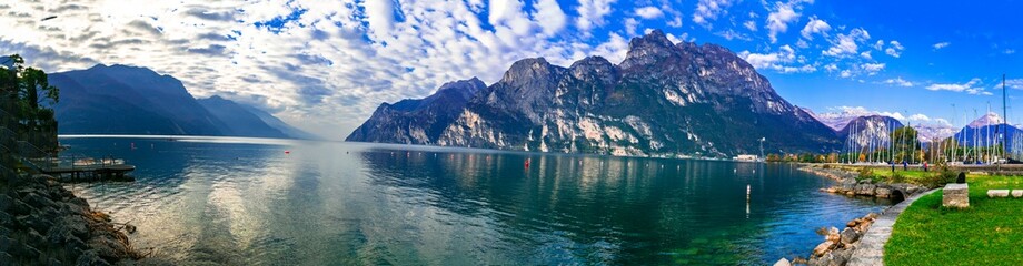 Obraz premium Italy travel ,scenic Garda lake , Trento province. Lago di Garda. Wonderful autumn scenery. sunny morning in Riva del Garda.