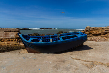 Wooden fishing boat on the waterfront of the old port. Essaouira, Morocco, Africa