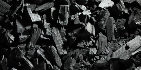 Heap of coal as background, top view