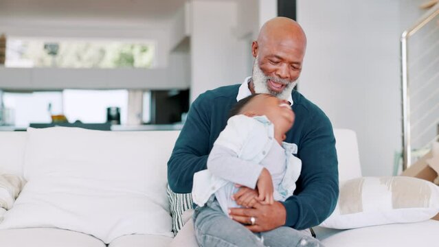 Grandfather, boy child and tickling on sofa with smile, funny or bonding in living room at black family home. Senior man, excited kid and play in embrace, relax or game in lounge, house or apartment