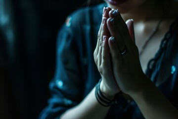 A dark background provides the backdrop as female hands are clasped in prayer, offering ample copy space generative ai