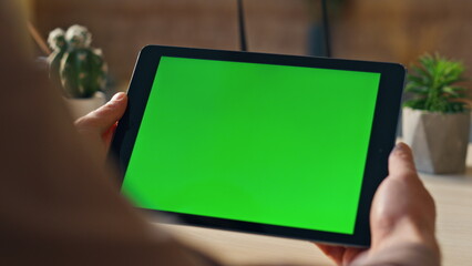 Freelancer hands holding tablet working remote at home close up. Mockup monitor