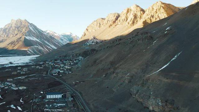 4K aerial shot of Himalaya mountains, Key monastery and  village in Spiti Valley, India. Spiti valley landscape during winter season. Ancient Tibetan Buddhist monastery on top of a hill. 