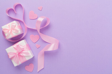 Valentines day composition with gifts on color background, top view.