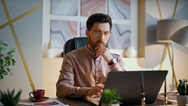 Business man working office looking on laptop close up. Manager thinking job