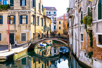 Fototapeta na wymiar romantic Venetian streets and canals. Bridges of Venice town, Italy