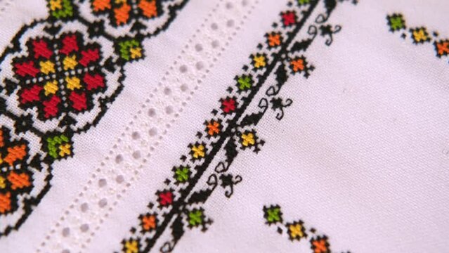 Ukrainian embroidered folk pattern ornament. Design of ethnic textures. Geometric ornament. Embroidered element with a cross stitch with colored cotton threads.