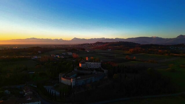 Sunset on the Friulian hills with a view of the Villalta castle. Fagagna.
