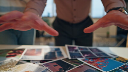 Creative team working together at conference hall putting design samples on desk