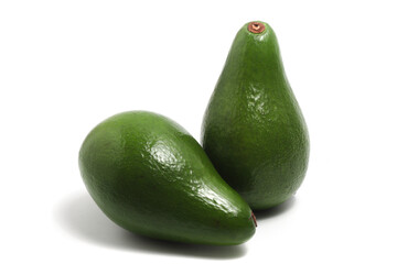 Two whole fresh organic avocado delicious fruit side view isolated on white background clipping path