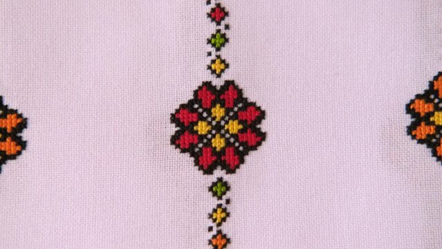 Slavic cross stitch by colored threads. Design of ethnic pattern. Background with Embroidery Texture.