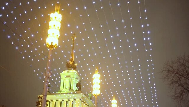  People are walking near main pavilion VVC in VDNKH.