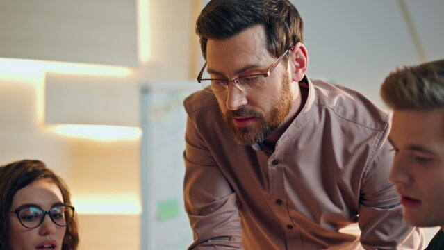 Colleagues talking business meeting at coworking office closeup. Brainstorming