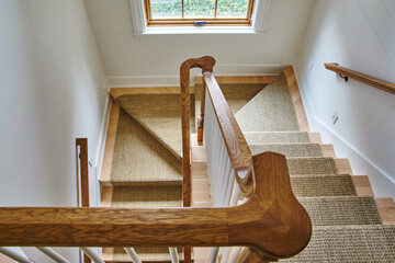 Elegant Modern Staircase with Carpet Runner and Wood Details