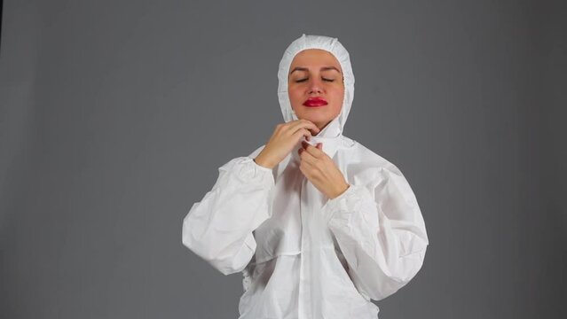 Beautiful girl undress chemical protection, mask and glasses