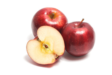 Half cut and two whole fresh organic red apple delicious fruit isolated on white background clipping path