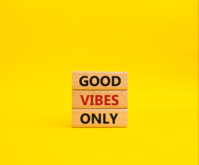 Good Vibes only symbol. Concept words Good Vibes only on wooden blocks. Beautiful yellow background. Business and Good Vibes only concept. Copy space.