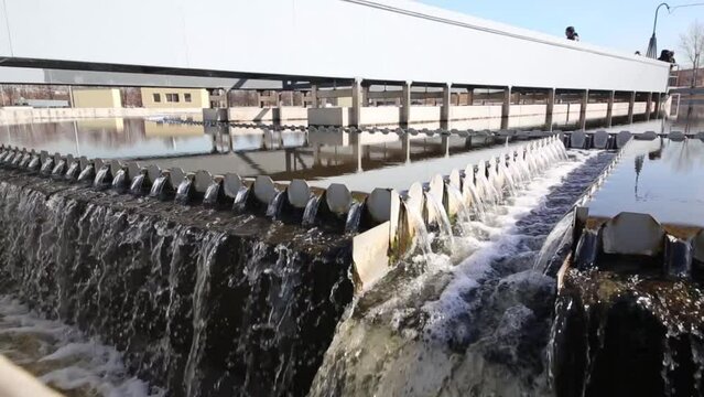 Wastewater flows through chute of settler in wastewater treatment plants