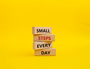 Small Steps Every Day symbol. Wooden blocks with words Small Steps Every Day. Beautiful yellow background. Business and Small Steps Every Day concept. Copy space.