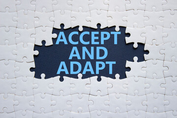 Accept or adapt symbol. Concept words Accept and adapt on white puzzle. Beautiful deep blue...