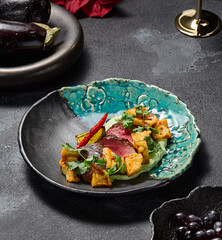 Marbled beef steak with crispy eggplants and wasabi puree, aesthetically pleasing and gourmet