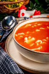 Tomato soup with noodles.