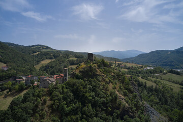 Fototapeta na wymiar Italy's charm unfolds: Castello di Pietramogolana and Viadotto Rio Pietramogolana in a stunning drone panorama. Explore the beauty of Pietramogolana PR.