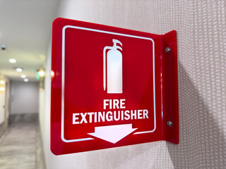 Fire extinguisher sign on a wall - 718276101