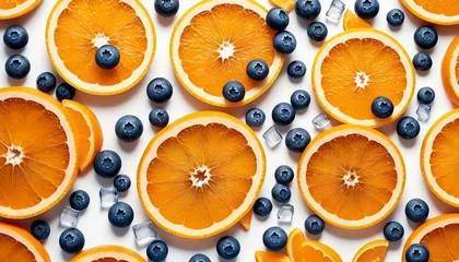 Fotobehang Orange slices with ice cubes and blueberries on white background © Copper