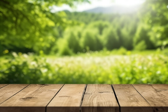 Wooden table and blurred green nature garden background. Old empty wooden table - green spring background