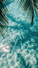 Fototapeta na wymiar Aesthetic telephone background of clear blue water with reflections and shadows of palm leaves. Tropical vacation vibe