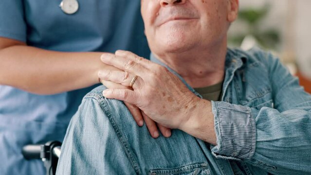 Man, hands and caregiver in elderly care, support or trust for healthcare, help or comfort at old age home. Closeup of female doctor or nurse touching person with a disability in wheelchair at house