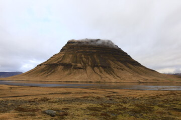 Obraz premium Kirkjufell is a remote mountain in Iceland, located on the Snæfellsnes peninsula